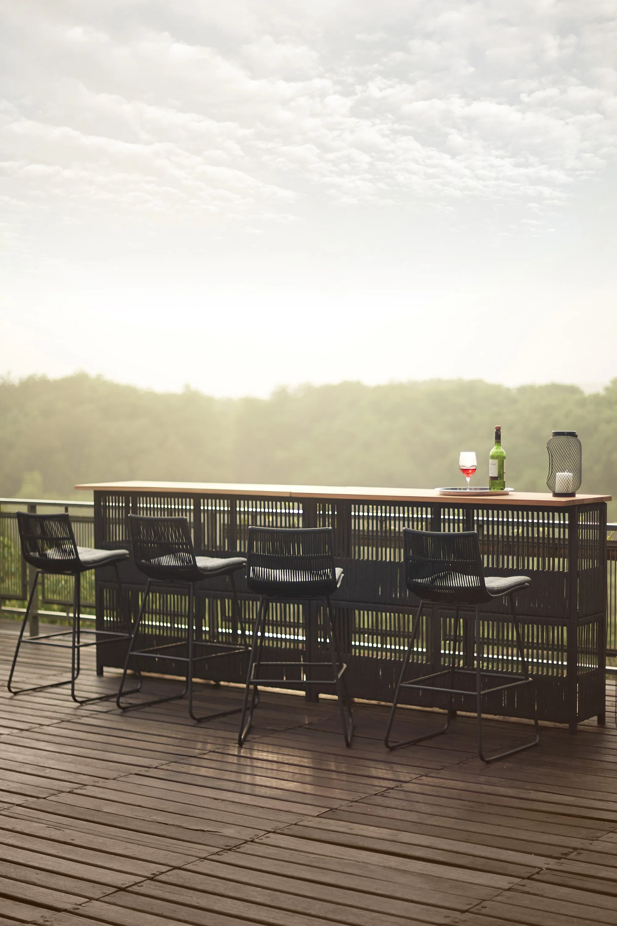Outdoor bar counter and bar chairs